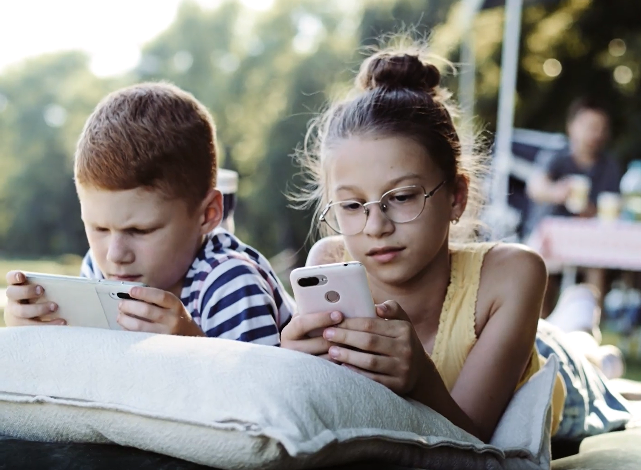 Children at the campsite with their smartphones